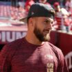 49ers rookie Ricky Pearsall poses with first responders who helped save his life after shooting at game