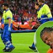 Man City defender Nathan Ake is taken off on a stretcher in tears after suffering serious injury in Netherlands' Nations League clash with Germany