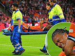 Man City defender Nathan Ake is taken off on a stretcher in tears after suffering serious injury in Netherlands' Nations League clash with Germany