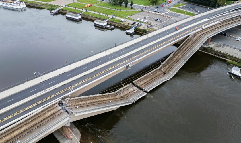 Parts of the Carola Bridge over the Elbe have collapsed in Dresden, Germany, Wednesday, Sept. 11, 2024. (Robert Michael/dpa via AP)