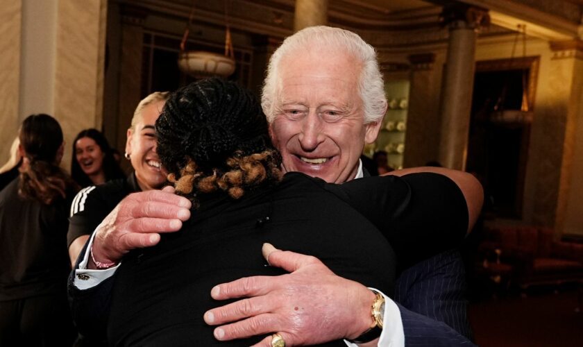 'Why not': King giggles as he finds himself in group hug with New Zealand rugby team