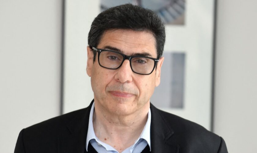 French Economist Philippe Aghion poses at the College de France in Paris on June 08, 2021. (Photo by Eric PIERMONT / AFP)