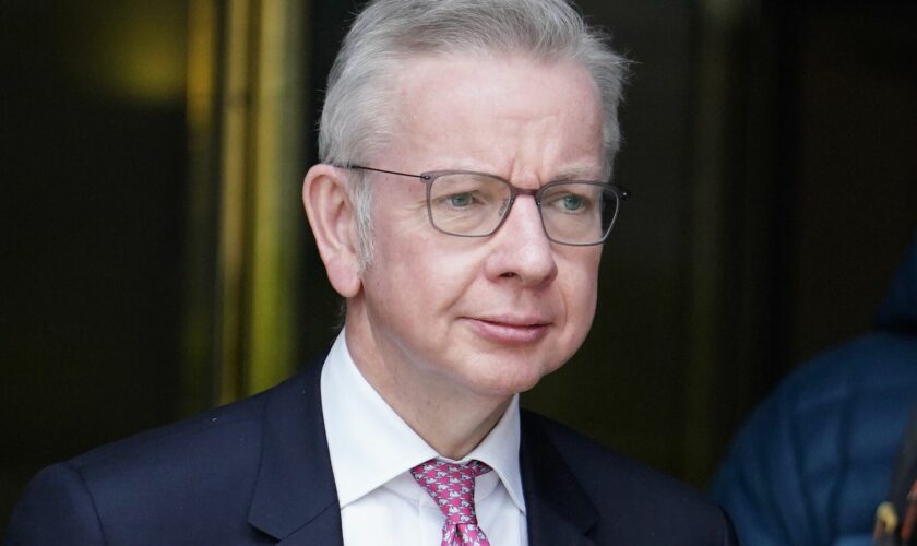 Michael Gove, leaves the Millbank Studios in central London after taking part in the morning interview rounds