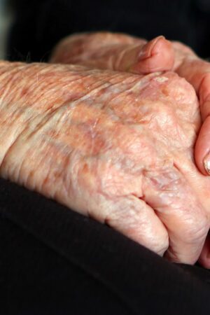 File photo dated 07/10/13 of the hands of an elderly woman at home. Councils are struggling to meet rising requests for adult social care support and some people are cutting back on their home care amid the cost-of-living crisis while "completely overwhelmed" family carers try to fill the gaps, the health watchdog has said. Issue date: Friday October 20, 2023.