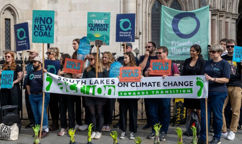 Campaigners against the proposed Whitehaven coal mine outside court during the hearing in July. Pic: Friends of the Earth