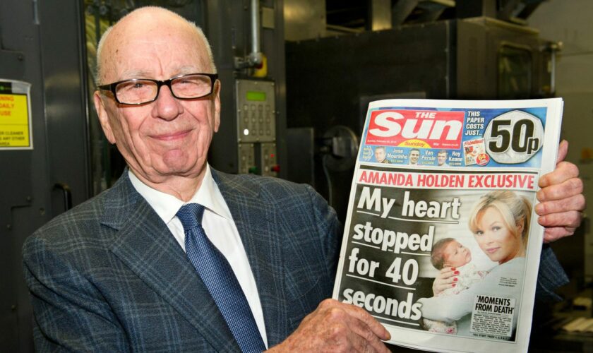 BROXBOURNE, UNITED KINGDOM - FEBRUARY 25:  (EDITORS NOTE: THIS IMAGE IS FREE FOR USE UNTIL MARCH 3 2012)  In this handout photograph provided by News International, Rupert Murdoch, Chairman and CEO of News Corporation, reviews the first edition of The Sun On Sunday as it comes off the presses on February 25, 2012 in Broxbourne, England. Around 3 million copies of 'The Sun On Sunday', the first ever Sunday edition of News International's daily tabloid newspaper 'The Sun', are due to go on sale on Sunday February 26, 2012.  (Picture Arthur Edwards/News International via Getty Images)