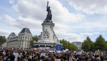 People take part in a gathering at Place de la Rebublique in support of 71-year-old Gisele Pelicot who was allegedly drugged by her ex-husband and raped by dozens of men while unconscious, Saturday, Sept. 14, 2024 in Paris.  (AP Photo/Michel Euler)