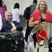 Eamonn Holmes, 64, arrives home with girlfriend Katie Alexander, 42, as they touch down at Heathrow after romantic trip that left estranged wife Ruth Langsford shocked