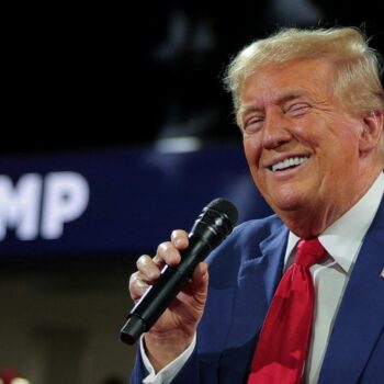 Republican presidential nominee and former U.S. President Donald Trump holds a campaign town hall meeting, moderated by Arkansas Governor Sarah Huckabee Sanders, in Flint, Michigan, U.S., September 17, 2024. REUTERS/Brian Snyder