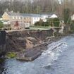 Neighbours told they will have to fork out £450,000 to fix collapsed wall threatening to cause their homes to fall into a river