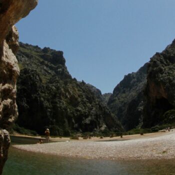 People sunbath at the "Torrent de Pareis" canyon, part of the cultural landscape of the Sierra de Tramuntana, on the northwestern coast of the Spanish Balearic island of Mallorca June 28, 2011. The cultural landscape of the Sierra de Tramuntana (Tramuntana mountain range) was inscribed on UNESCO's World Heritage List on Monday. REUTERS/ Enrique Calvo (SPAIN - Tags: ENVIRONMENT TRAVEL SOCIETY)