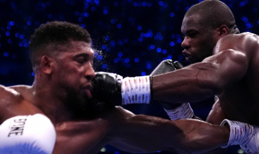 Anthony Joshua (left) and Daniel Dubois in the IBF World Heavy weight bout at Wembley Stadium, London. Picture date: Saturday September 21, 2024. PA Photo. See PA story BOXING London. Photo credit should read: Bradley Collyer/PA Wire...RESTRICTIONS: Use subject to restrictions. Editorial use only, no commercial use without prior consent from rights holder.