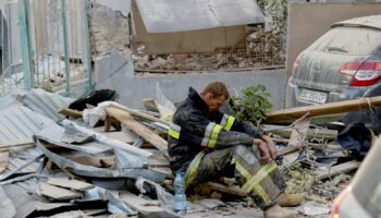 A rescuer rests at the site of a Russian drone and missile strike on residential buildings, amid Russia's attack on Ukraine, in Lviv, Ukraine September 4, 2024. REUTERS/Roman Baluk     TPX IMAGES OF THE DAY