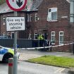 The scene in Salford where a 40-year-old woman and an eight-year-old girl have both been found dead inside a property