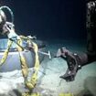 New video showing deep-sea salvage of Titan sub is released as OceanGate employee hits back at accusations there was a 'desperation' to complete dives in doomed vessel