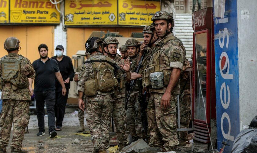 Lebanese soldiers at a building hit by an Israeli airstrike in Beirut. Pic: AP