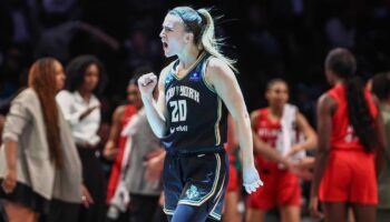 Liberty's Sabrina Ionescu reacts to interaction with Spike Lee as New York secures spot in semifinals