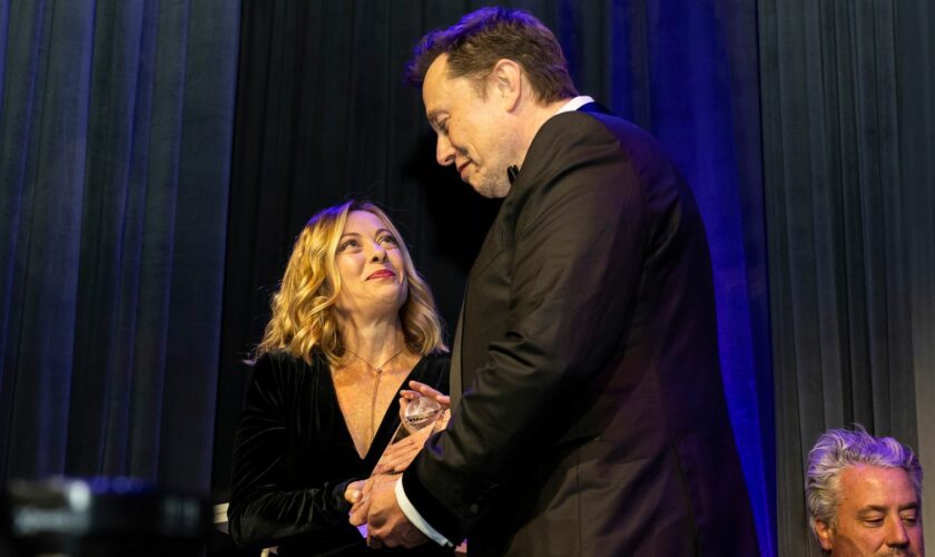 Elon Musk presents Giorgia Meloni with an award during the Global Citizen Awards dinner. Pic: AP