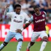 Players from Aston Villa (left) and West Ham compete on the first game of the 2024 season - with both teams featuring gambling companies across their shirts. Pic: PA