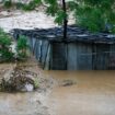 A tin shed lies partially submerged at the edge of the Bagmati River in spate after heavy rains in Kathmandu, Nepal, Saturday, Sept. 28, 2024. (AP Photo/Gopen Rai)