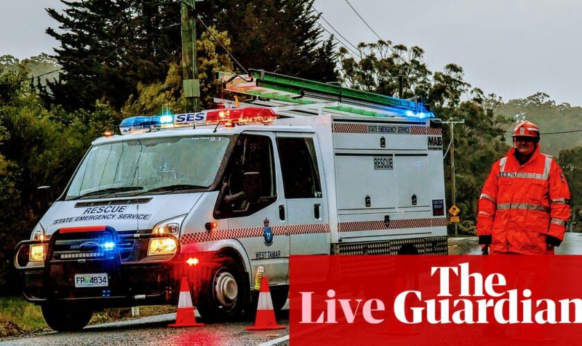 Australia news live: woman killed after tree falls on cabin; tens of thousands without power after night of wild storms