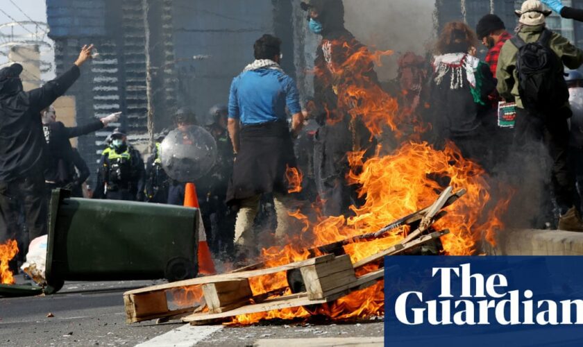 Dozens injured and 39 arrested in fiery confrontations between weapons expo protesters and police in Melbourne