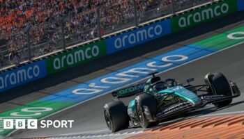 Aston Martin's Lance Stroll on track during the Netherlands Grand Prix with Aramco sponsorship visible on the barriers and his car