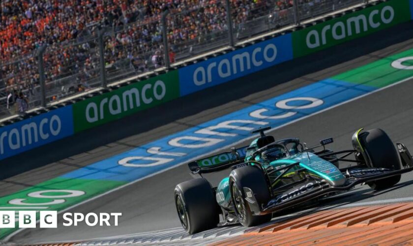 Aston Martin's Lance Stroll on track during the Netherlands Grand Prix with Aramco sponsorship visible on the barriers and his car