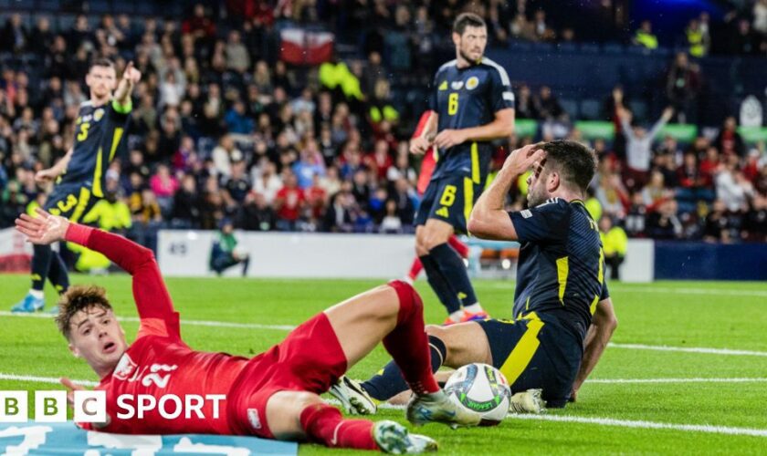 Scotland's Grant Hanley concedes a penalty against Poland