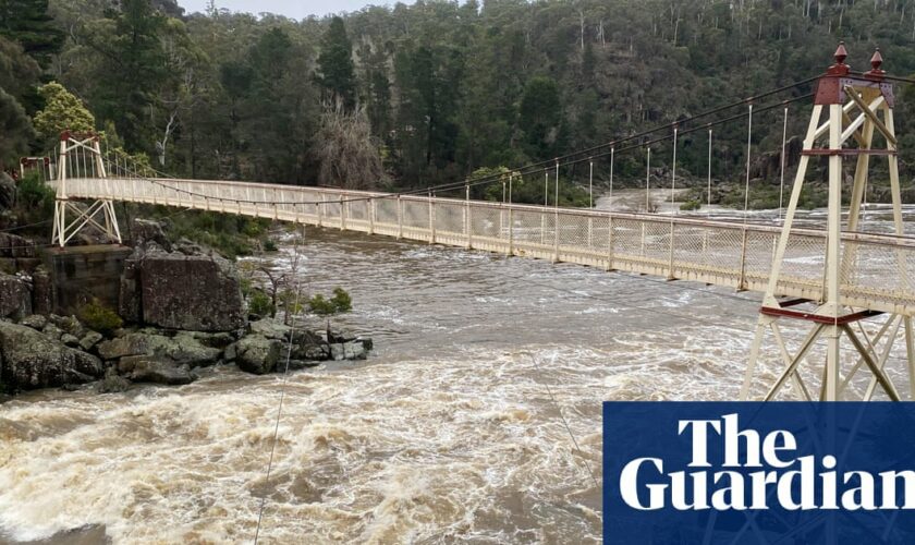 Tasmanians prepare to evacuate amid major flood warning as Victorians warned of destructive winds