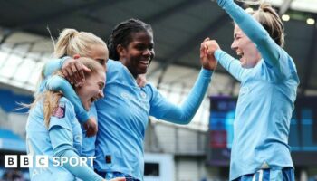 Manchester City celebrate scoring a goal last season