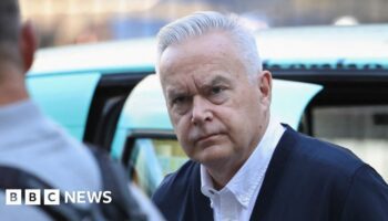 Watch: Silent Huw Edwards walks into court building