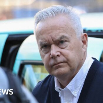 Watch: Silent Huw Edwards walks into court building