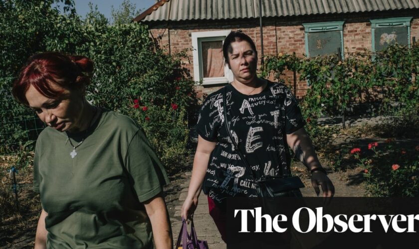 ‘Everything is left behind’: as Russians close in on Ukrainian city, families agonise whether to flee