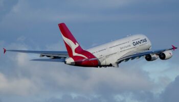 FILE - A Qantas A380 takes off from Sydney Airport over Botany Bay in Sydney, Australia, Monday, Sept. 5, 2022. Australian national carrier Qantas posted an underlying pre-tax half-year profit of 1.43 billion Australian dollars ($978 million) on Thursday, Feb. 23, 2023, in the airline's first return to profit since the coronavirus pandemic started three years ago. (AP Photo/Mark Baker/File)