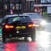 Britain battles floods to get to work as roads are closed after thunderstorms overnight and south coast is 'hit by tornado'