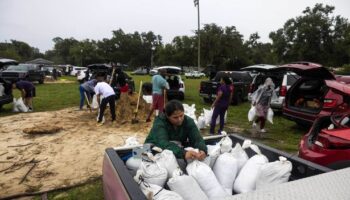 Hurricane Milton: Floridians resort to digging trenches and using mulch as sand runs out