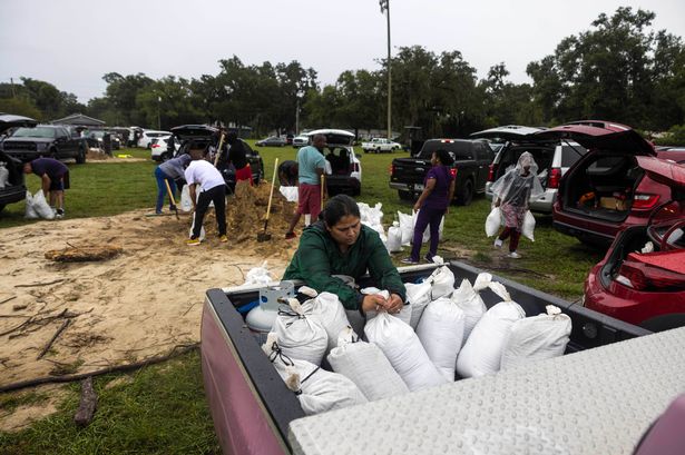 Hurricane Milton: Floridians resort to digging trenches and using mulch as sand runs out