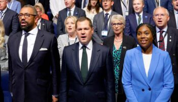 Conservative MPs and leadership candidates, Tom Tugendhat, Shadow Home Secretary James Cleverly, Robert Jenrick and Kemi Badenoch sing the national anthem on the final day of the Conservative Party conference in Birmingham, Britain, October 2, 2024. REUTERS/Toby Melville