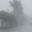 A Lee County Sheriff's officer patrols the streets of Cape Coral, Fla., as heavy rain falls ahead of Hurricane Milton, Wednesday, Oct. 9, 2024. (AP Photo/Marta Lavandier)