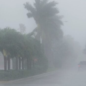 A Lee County Sheriff's officer patrols the streets of Cape Coral, Fla., as heavy rain falls ahead of Hurricane Milton, Wednesday, Oct. 9, 2024. (AP Photo/Marta Lavandier)