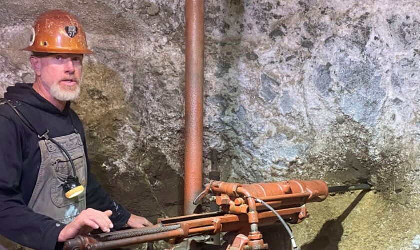 Patrick Weier working as a tour guide at the mine. Pic: AP