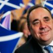 Scotland's then first minister Alex Salmond smiles surrounded by national flags in 2007. Pic: Reuters