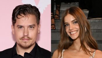 Dylan Sprouse supports Barbara Palvin at Victoria’s Secret Fashion Show with cardboard cutouts of their pets