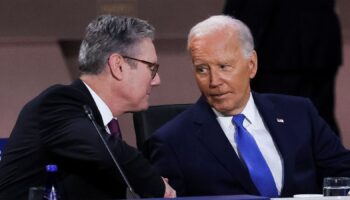 U.S. President Joe Biden looks at Britain's Prime Minister Keir Starmer at a meeting of the North Atlantic Council at the level of Heads of State and Government, Indo-Pacific and European Union during NATO's 75th anniversary summit in Washington, U.S., July 11, 2024. REUTERSLeah Millis