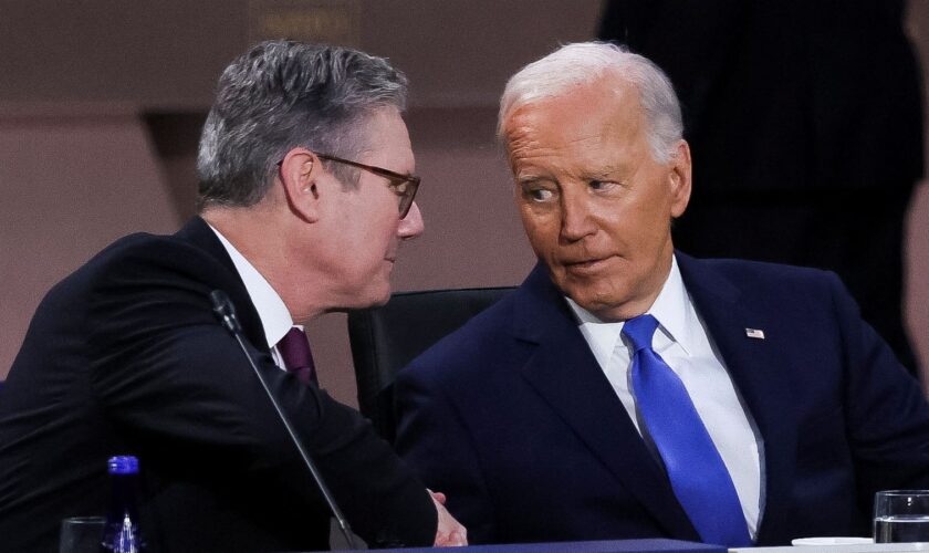 U.S. President Joe Biden looks at Britain's Prime Minister Keir Starmer at a meeting of the North Atlantic Council at the level of Heads of State and Government, Indo-Pacific and European Union during NATO's 75th anniversary summit in Washington, U.S., July 11, 2024. REUTERSLeah Millis