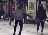 Terrifying moment two masked men 'with machetes' go head to head on a busy London high street - as witnesses cry for them to 'stop'