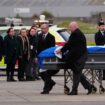 Alex Salmond's body is repatriated to the UK, watched by members of his family and acting Alba Party leader Kenny MacAskill. Pic: PA