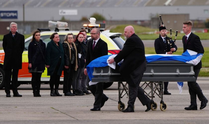 Alex Salmond's body is repatriated to the UK, watched by members of his family and acting Alba Party leader Kenny MacAskill. Pic: PA