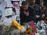 Liam Payne's heartbroken father pauses to kiss pictures of his son at fans' makeshift shrine to One Direction star in Buenos Aires